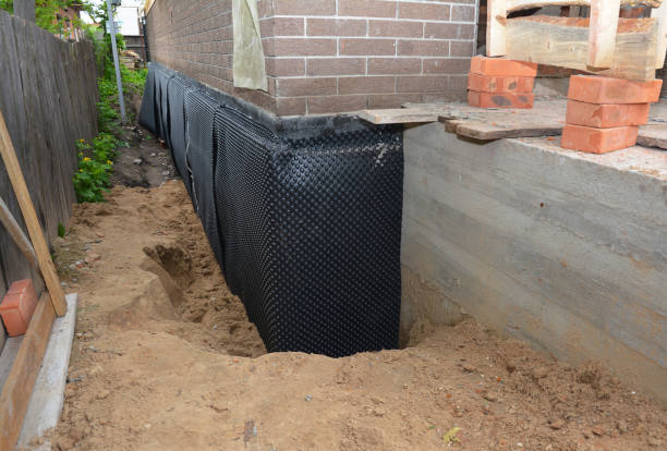 Happy homeowners after waterproofing job in Defiance